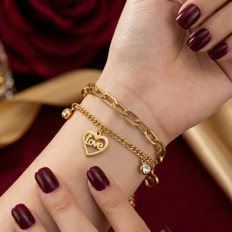A gold bracelet made of rust-resistant stainless steel, with two layers of chains, heart-shaped pendants filled with the word Love with shiny stones, and an adjustable clasp to fit you. - Image 2